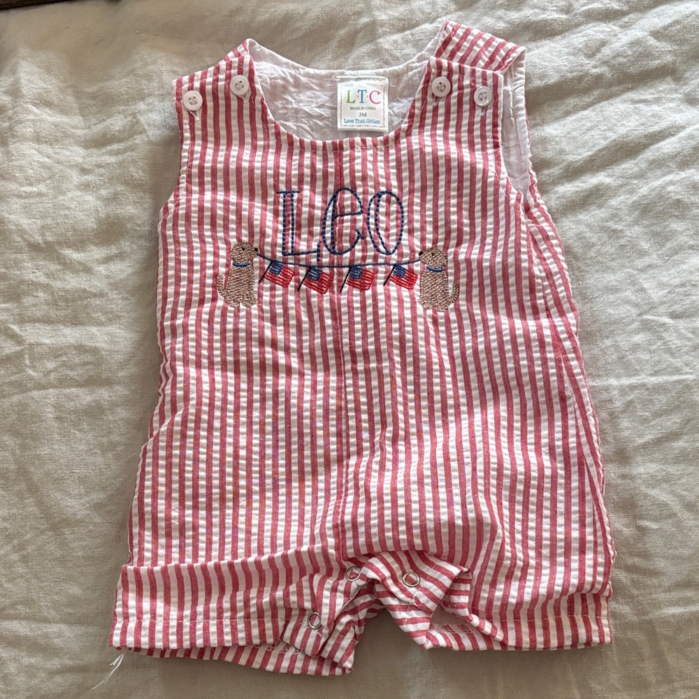 Red Searsucker Romper Jon Jon “Leo” with flags and dogs patriotic